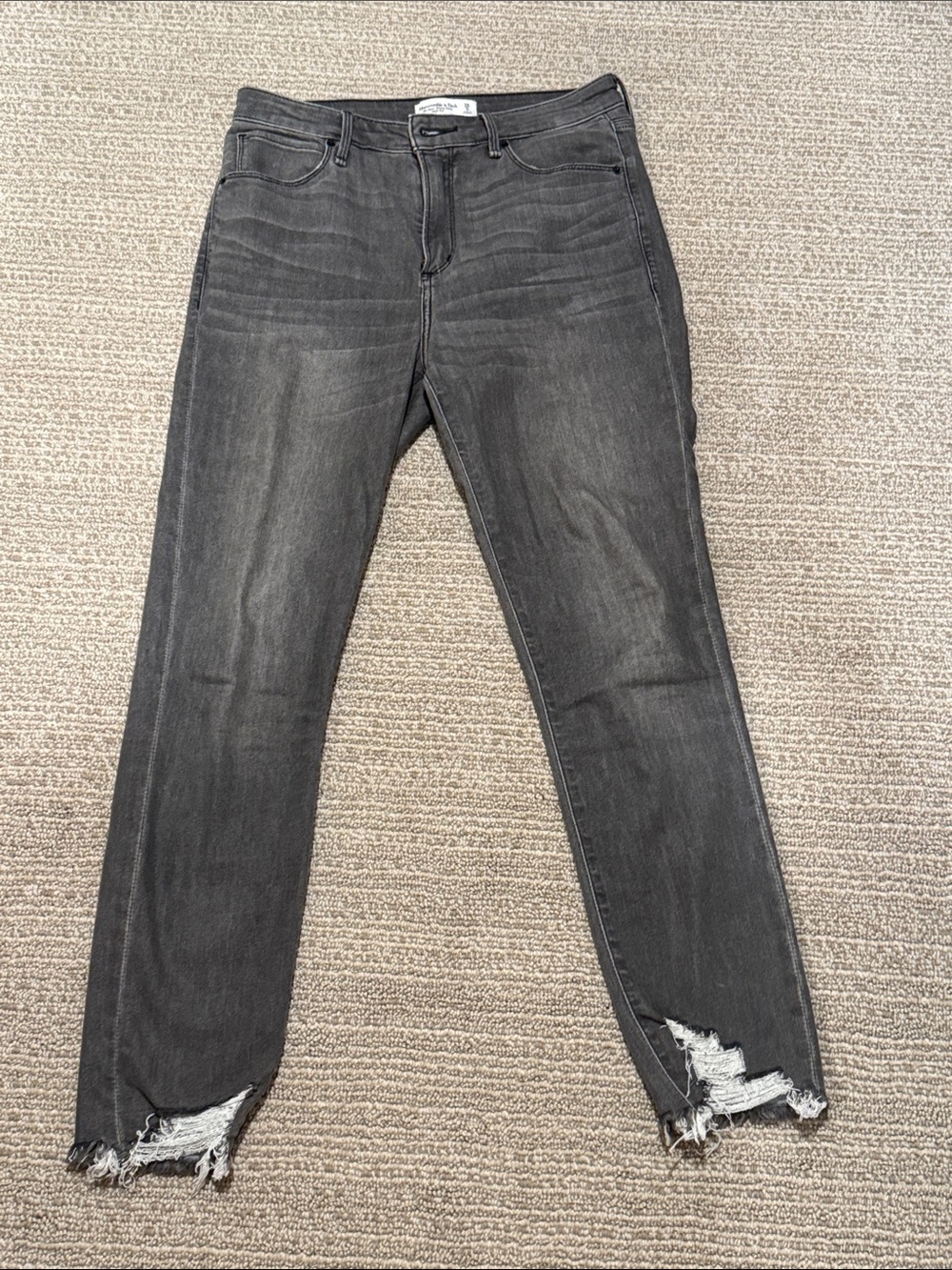 Abercrombie & Fitch The Super Skinny Ankle High Rise Jeans with Distressed Hem